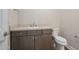 Well-lit half bathroom featuring a modern vanity and fixtures at 2121 W Sonoran Desert Dr # 21, Phoenix, AZ 85085