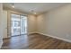 Light-filled bedroom with wood-look floors, neutral walls and sliding glass doors to the outside at 2121 W Sonoran Desert Dr # 21, Phoenix, AZ 85085
