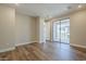 Bright bedroom featuring wood floors, neutral walls, and sliding glass doors to a balcony at 2121 W Sonoran Desert Dr # 21, Phoenix, AZ 85085
