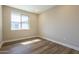 Bright bedroom with wood floors and a large window offering plenty of natural light at 2121 W Sonoran Desert Dr # 21, Phoenix, AZ 85085