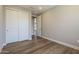 Neutral bedroom with wood floors and white closet doors, offering ample storage at 2121 W Sonoran Desert Dr # 21, Phoenix, AZ 85085