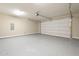 Spacious two car garage featuring epoxy floors, overhead lighting, and automatic door opener at 2121 W Sonoran Desert Dr # 21, Phoenix, AZ 85085