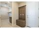 Functional mudroom with a storage bench and coat rack upon entry, with the laundry room to the left at 2121 W Sonoran Desert Dr # 21, Phoenix, AZ 85085