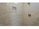 Close up of tiled shower featuring subway tile, built in niche, and modern fixtures at 2121 W Sonoran Desert Dr # 21, Phoenix, AZ 85085