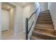 Elegant staircase with wood steps and glass railing provides a stylish transition between floors at 2121 W Sonoran Desert Dr # 21, Phoenix, AZ 85085