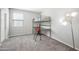 Contemporary bedroom with a metal loft bed, a desk area, and a striking floor lamp at 2167 W Ethan Ct, San Tan Valley, AZ 85144