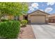 Charming single-story home with a well-maintained landscaped front yard and concrete driveway at 2167 W Ethan Ct, San Tan Valley, AZ 85144