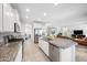 Bright kitchen featuring granite countertops, stainless steel appliances, and an open floor plan at 2167 W Ethan Ct, San Tan Valley, AZ 85144