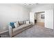 Comfortable living room featuring a large sofa and neutral decor at 2167 W Ethan Ct, San Tan Valley, AZ 85144