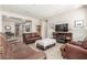 Spacious living room featuring a comfortable seating arrangement, fireplace, and neutral color palette at 2167 W Ethan Ct, San Tan Valley, AZ 85144