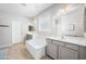 Bright main bathroom featuring double sinks, a soaking tub, and modern fixtures at 2167 W Ethan Ct, San Tan Valley, AZ 85144