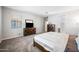 Serene main bedroom featuring carpet, neutral colors, and a view to the attached bathroom at 2167 W Ethan Ct, San Tan Valley, AZ 85144