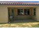 Covered back patio providing an outdoor living area with ample space for relaxation and a grill at 2167 W Ethan Ct, San Tan Valley, AZ 85144