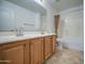 Bathroom featuring double sink vanity, large mirror, and shower/tub combo at 2375 E Fiesta Dr, Casa Grande, AZ 85194