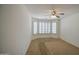 Bedroom with a ceiling fan and lots of natural light from a bay window at 2375 E Fiesta Dr, Casa Grande, AZ 85194