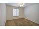 Bedroom with a ceiling fan, window with blinds, and carpeted floor at 2375 E Fiesta Dr, Casa Grande, AZ 85194