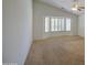 Spacious bedroom featuring a vaulted ceiling, bay window, and plush carpeting at 2375 E Fiesta Dr, Casa Grande, AZ 85194