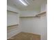 Walk-in closet with built-in shelving and carpeted floor at 2375 E Fiesta Dr, Casa Grande, AZ 85194