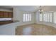 Dining area featuring tile floors, plantation shutters, and a decorative chandelier at 2375 E Fiesta Dr, Casa Grande, AZ 85194