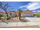 Charming single-story home with desert landscaping, mature trees, and a two-car garage at 2375 E Fiesta Dr, Casa Grande, AZ 85194