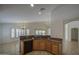 Open kitchen view with breakfast bar, and a view into the living room and dining area at 2375 E Fiesta Dr, Casa Grande, AZ 85194