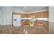 Well-equipped kitchen with white appliances, oak cabinetry, and granite countertops at 2375 E Fiesta Dr, Casa Grande, AZ 85194