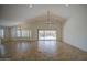 Spacious living room with vaulted ceilings, tile floors, and large sliding doors to the backyard at 2375 E Fiesta Dr, Casa Grande, AZ 85194