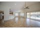 Spacious living room with tile flooring, vaulted ceilings, and sliding glass doors to the patio at 2375 E Fiesta Dr, Casa Grande, AZ 85194