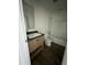 Modern bathroom with vanity, sink, and a tub/shower combo; updated fixtures present at 25958 W Muirfield Dr, Morristown, AZ 85342