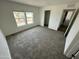 Spacious bedroom with large windows provides ample natural light and scenic views of the surrounding area at 25958 W Muirfield Dr, Morristown, AZ 85342