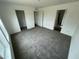 This bedroom is bright and airy, with multiple doorways creating an open and flowing layout at 25958 W Muirfield Dr, Morristown, AZ 85342