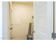 Hall closet with shelving for storage, access door, and neutral paint at 25958 W Muirfield Dr, Morristown, AZ 85342