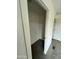 This practical walk-in closet provides storage space with a shelf; carpeted for comfort at 25958 W Muirfield Dr, Morristown, AZ 85342