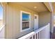 Close-up view of the cozy covered front porch of the home at 25958 W Muirfield Dr, Morristown, AZ 85342