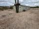 Single-story home surrounded by desert landscape with easy access to utilities at 25958 W Muirfield Dr, Morristown, AZ 85342
