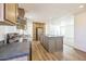 Well-appointed kitchen featuring a center island and modern appliances at 25958 W Muirfield Dr, Morristown, AZ 85342