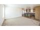 Spacious living room flowing into the open-concept kitchen area at 25958 W Muirfield Dr, Morristown, AZ 85342