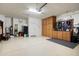 Spacious garage featuring ample storage cabinets and an epoxy floor at 27391 W Wahalla Ln, Buckeye, AZ 85396