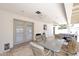 Covered back patio with stone floors, ceiling fans, dining area and comfortable seating at 2808 E Lupine Ave, Phoenix, AZ 85028
