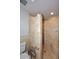 This tiled shower has a rain shower head and a bench at 2808 E Lupine Ave, Phoenix, AZ 85028