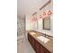 Elegant bathroom with double sinks, stylish mirrors, and a combined shower and tub at 2808 E Lupine Ave, Phoenix, AZ 85028