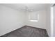 Bright bedroom featuring soft carpet, neutral walls, and a ceiling fan at 2808 E Lupine Ave, Phoenix, AZ 85028