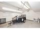Spacious garage interior featuring concrete floors, shelving and ample storage at 2808 E Lupine Ave, Phoenix, AZ 85028