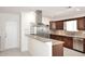 Updated kitchen featuring granite countertops, stainless steel appliances, and ample cabinet space at 2808 E Lupine Ave, Phoenix, AZ 85028