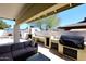 An outdoor grill station with built-in features on a covered patio at 2808 E Lupine Ave, Phoenix, AZ 85028