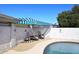 View of the pool area and the shady awning and outdoor seating area at 2808 E Lupine Ave, Phoenix, AZ 85028