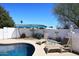 The pool area features lounge seating and a shaded cover for outdoor relaxation at 2808 E Lupine Ave, Phoenix, AZ 85028