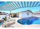The pool area includes a shady awning, outdoor dining, and a private pool at 2808 E Lupine Ave, Phoenix, AZ 85028
