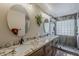 Bathroom featuring double sinks, granite counters, and a marble shower at 29322 N Red Finch Dr, San Tan Valley, AZ 85143