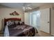 Bedroom with a ceiling fan and two doors at 29322 N Red Finch Dr, San Tan Valley, AZ 85143